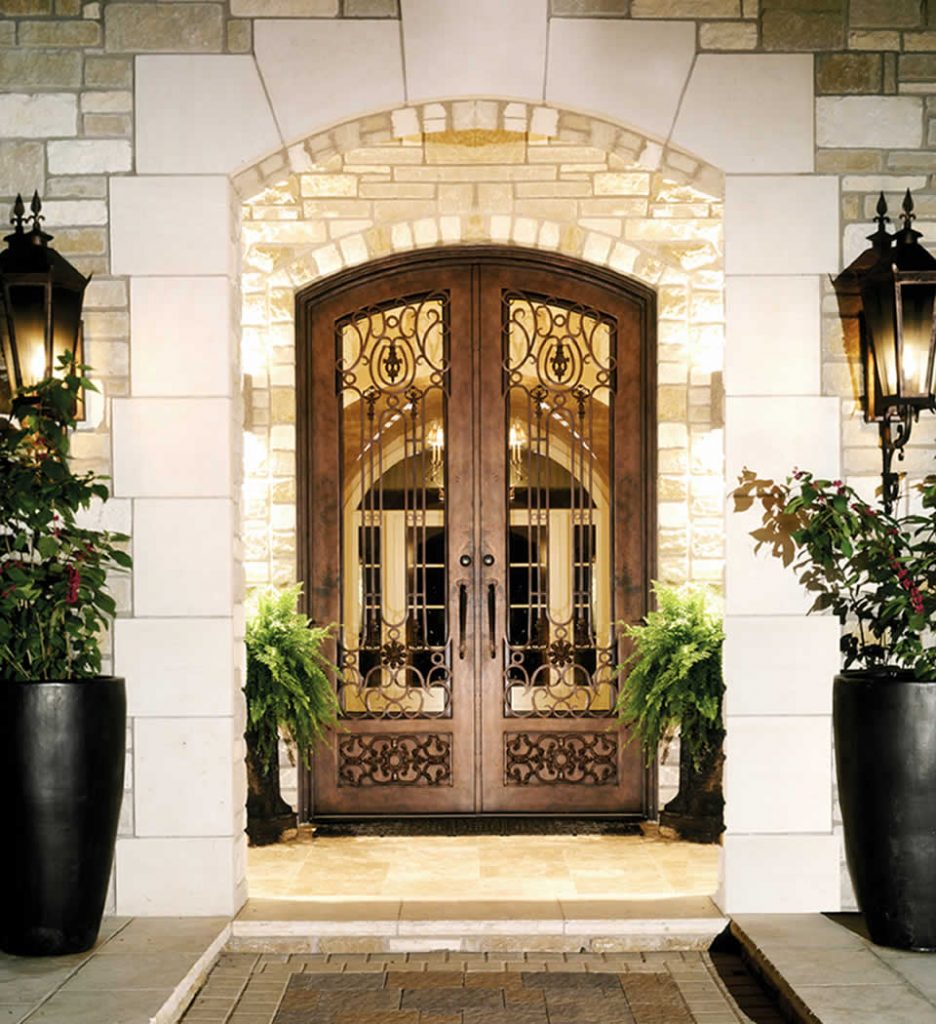Elegant arched wooden double doors with wrought iron detailing